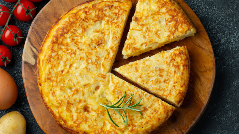 Frittata top down view with veggies and herbs