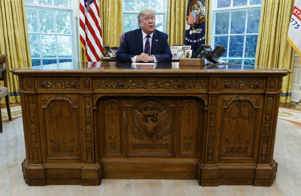 President Donald Trump speaks in the Oval Office of the White House in Washington, Friday, July 26, 2019. Trump announced that Guatemala is signing an agreement to restrict asylum applications to the U.S. from Central America. (AP Photo/Carolyn Kaster)