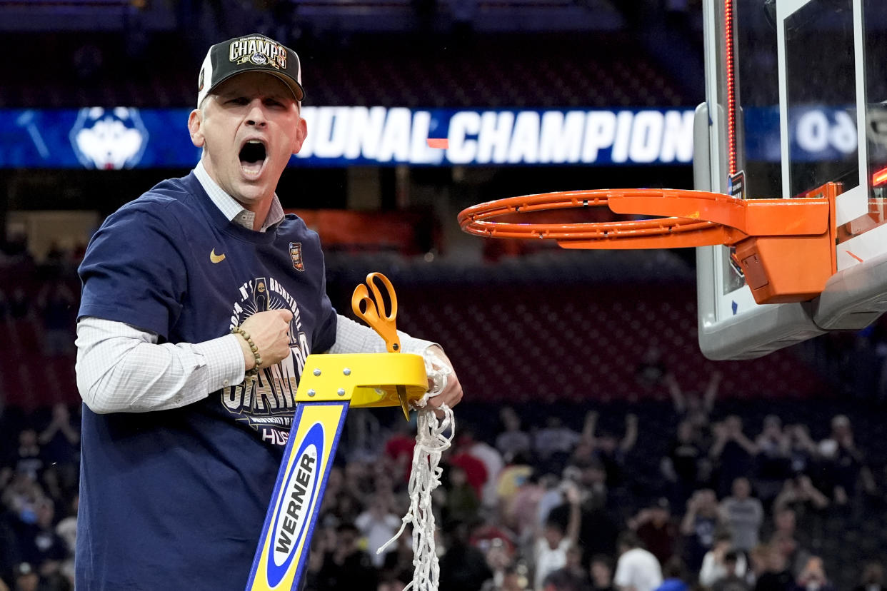 UConn head coach Dan Hurley celebrates cutting the net after their win against Purdue in the NCAA  championship game on Monday in Glendale, Ariz. (AP Photo/David J. Phillip)