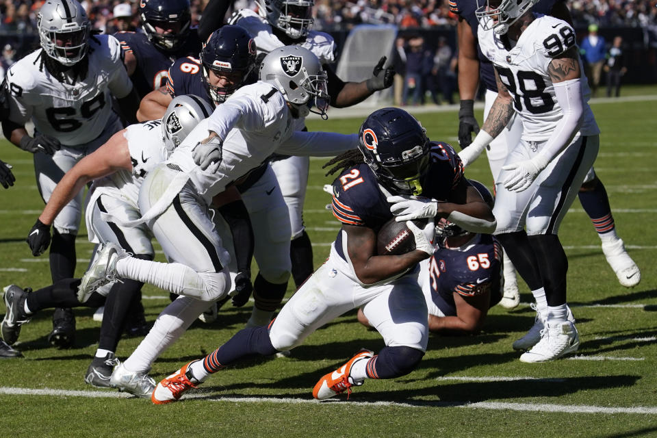 Chicago Bears running back D'Onta Foreman (21) scores a touchdown against the Las Vegas Raiders in the first half of an NFL football game Sunday, Oct. 22, 2023, in Chicago. (AP Photo/Charles Rex Arbogast)