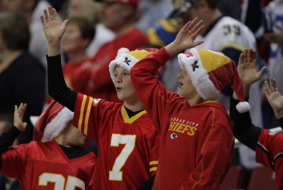 FILE - In this Dec. 19, 2010, file photo, Kansas City Chiefs fans celebrate with the tomahawk chop during the fourth quarter of an NFL football game against the St. Louis Rams in St. Louis. While other sports teams using Native American nicknames and imagery have faced decades of protests and boycotts, the Chiefs have largely slid under the radar. Vincent Schilling, associate editor of Indian Country Today, said it's time for the Chiefs to face the music. "When I see something like a tomahawk chop, which is derived from television and film portrayals, I find it incredibly offensive because it is an absolutely horrible stereotype of what a native person is." (AP Photo/Tom Gannam, File)