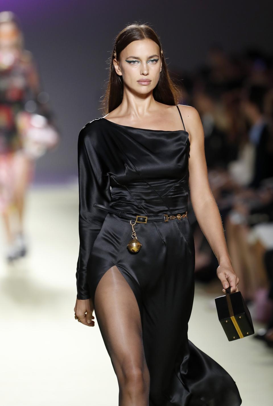 Model Irina Shayk wears a creation as part of Versace's women's 2019 Spring-Summer collection, unveiled during the Fashion Week in Milan, Italy, Friday, Sept. 21, 2018. (AP Photo/Antonio Calanni)