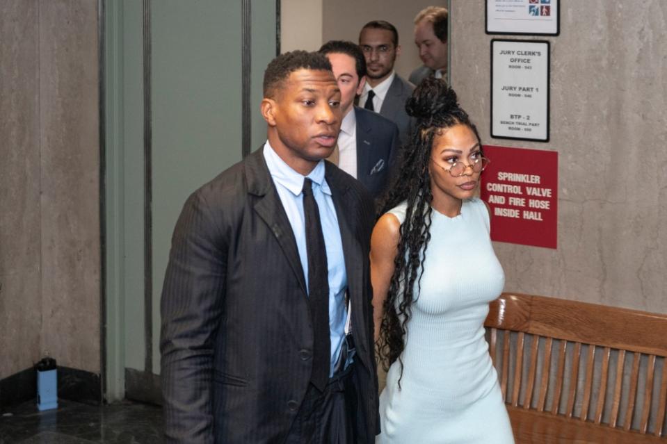 Jonathan Majors, accompanied by girlfriend Meagan Good, enters a courtroom at the Manhattan Criminal Courthouse in New York, Thursday, Dec. 14, 2023. (AP Photo/Peter K. Afriyie)