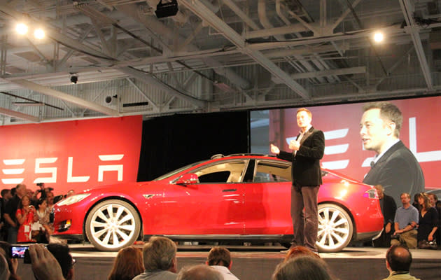 Elon Musk, CEO of Tesla Motors, introduces customers to the Model S sedan at the company's Fremont factory. 