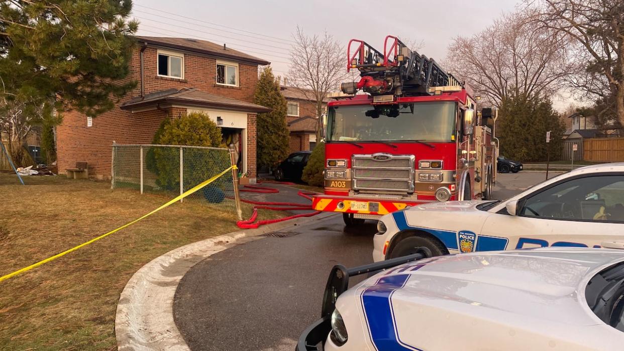 Mississauga Fire and Peel police at the scene of a fatal blaze on Bromsgrove Road early Tuesday. (Paul Smith/CBC - image credit)