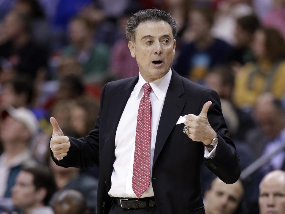 Louisville coach Rick Pitino calls for a jump ball during the first half of an NCAA college basketball game against Connecticut in the finals of the American Athletic Conference men's tournament Saturday, March 15, 2014, in Memphis, Tenn. (AP Photo/Mark Humphrey)