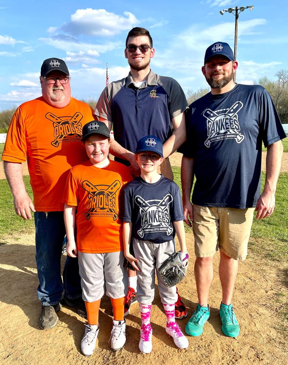 The Honesdale Little Baseball Association recently hosted Opening Day ceremonies for the 2024 season. Mark Ambrose (top, center) threw out the ceremonial first pitch. Pictured are (from left): Charlie Rollison, Maci Rollison, Ambrose, Genevieve Tallman, Chris Tallman.
