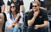 <p>The wait was over. Meghan and Harry finally made their first appearance together at the Invictus Games in Toronto. Aptly wearing a shirt called ‘The Husband’, the actress was pictured smiling and laughing next to her royal partner.<br><i>[Photo: Getty]</i> </p>