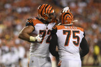 Cincinnati Bengals defensive end Kerry Wynn (72) celebrates with defensive end Jordan Willis (75) after the Bengals recovered a Washington Redskins fumble during the third quarter of an NFL preseason football game in Landover, Md., Thursday, Aug. 15, 2019. The Bengals won 23-13. (AP Photo/Susan Walsh)