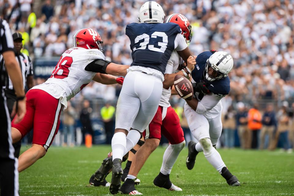 The ball comes loose as Penn State defensive end Dani Dennis-Sutton (33) strip sacks Indiana quarterback Brendan Sorsby late in the the second half of an NCAA football game against Indiana at Beaver Stadium Saturday, Oct. 28, 2023, in State College, Pa. The ball ended up going out of the end zone and resulted in a safety.