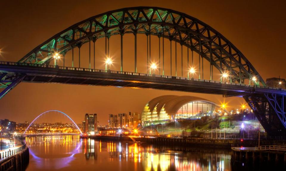 Tyne Bridge at night, with the Millennium Bridge and Sage in background.