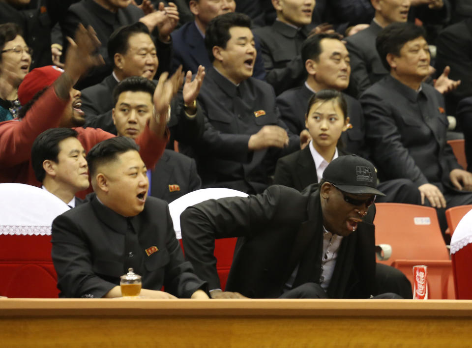 North Korean leader Kim Jong Un, left, and former NBA star Dennis Rodman watch North Korean and U.S. players in an exhibition basketball game at an arena in Pyongyang, North Korea, Thursday, Feb. 28, 2013. Rodman arrived in Pyongyang on Monday with three members of the Harlem Globetrotters basketball team to shoot an episode on North Korea for a new weekly HBO series. (AP Photo/VICE Media, Jason Mojica)