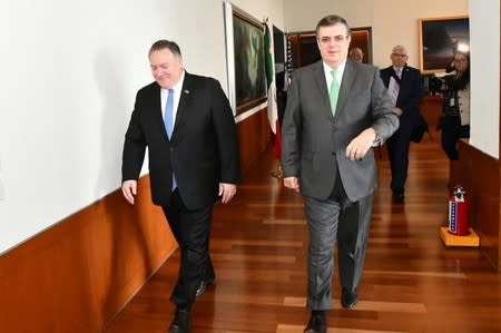 U.S Secretary of State Mike Pompeo walks with Mexican Foreign Minister Marcelo Ebrard during a private meeting at the Foreign Ministry Building (SRE) in Mexico City