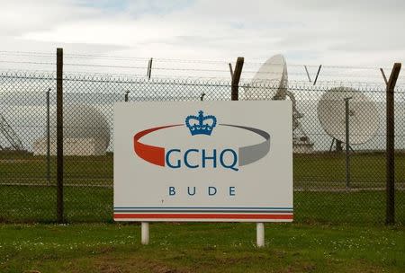 FILE PHOTO: Satellite dishes are seen at GCHQ's outpost at Bude, close to where trans-Atlantic fibre-optic cables come ashore in Cornwall, southwest England June 23, 2013. REUTERS/Kieran Doherty/File Photo