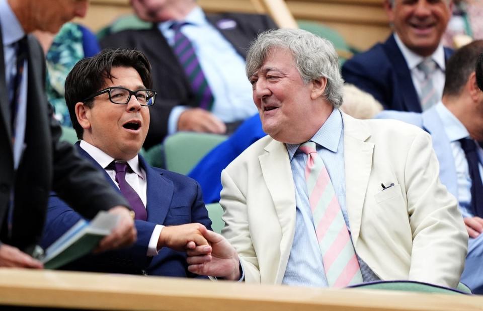 Comedian Michael McIntyre (centre) in the Royal Box with actor and comedian Stephen Dry (right) (Zac Goodwin/PA Wire)