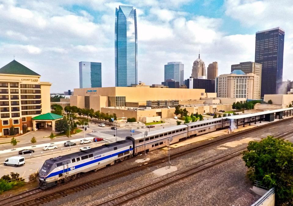 The Heartland Flyer is shown in this 2021 photo departing from the Santa Fe Train Station across the street from Prairie Surf Studios (formerly the Cox Convention Center). The former convention center is a leading candidate for construction of a new arena.