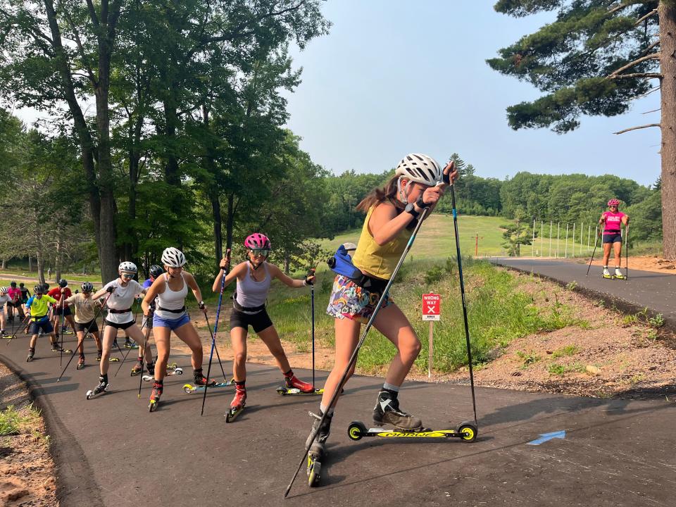Roller skiers train on the George Hovland Trail, a paved trail open to all kinds of users, from athletes to those who may have difficulties walking on uneven dirt trails.