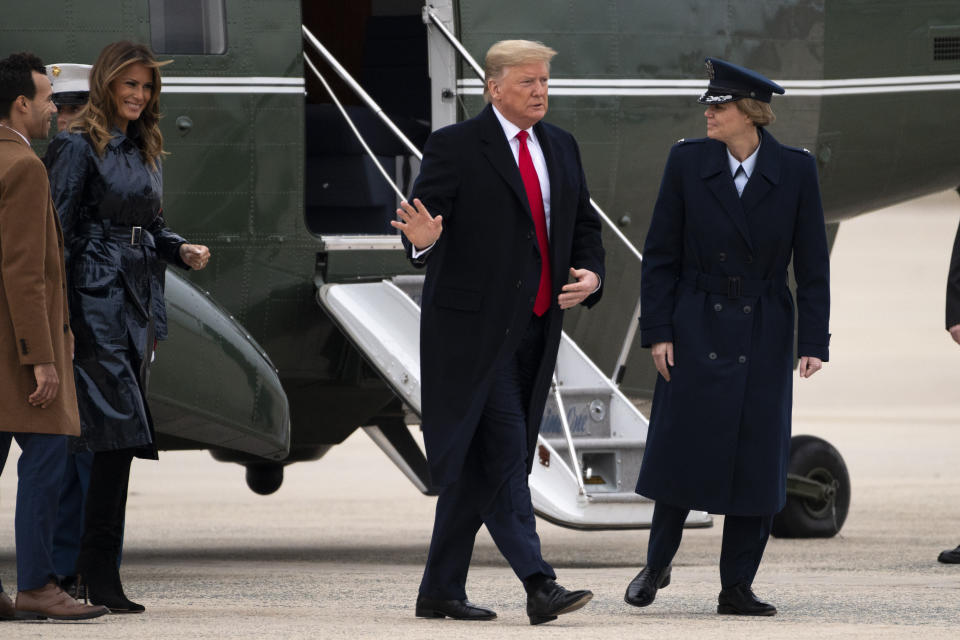 President Donald Trump and first lady Melania Trump exit Marine One on Monday, Jan. 13, 2020, at Andrews Air Force Base, Md., as he travels to attend the College Football National Championship game in New Orleans. (AP Photo/Kevin Wolf)