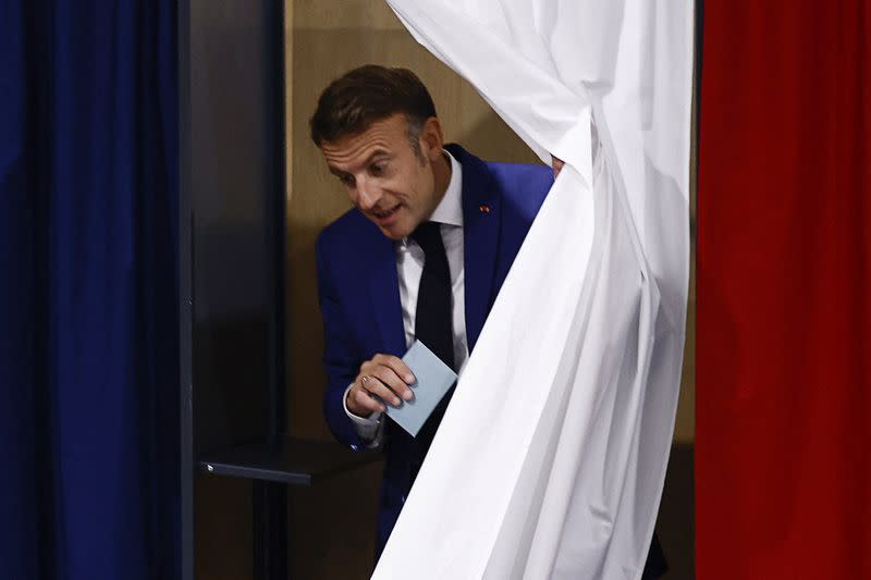 FILE PHOTO: French President Macron votes in the first round of the 2024 snap legislative elections