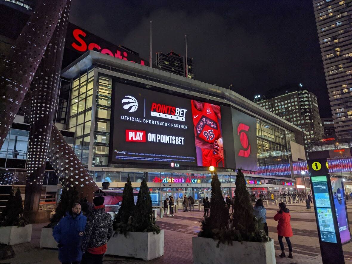 PointsBet Canada branding is displayed on a digital sign outside of Toronto's Scotiabank Arena, home of the Toronto Maple Leafs and Toronto Raptors. PointsBet Canada has an official sports betting partnership with both professional sports teams. (PointsBet Canada - image credit)