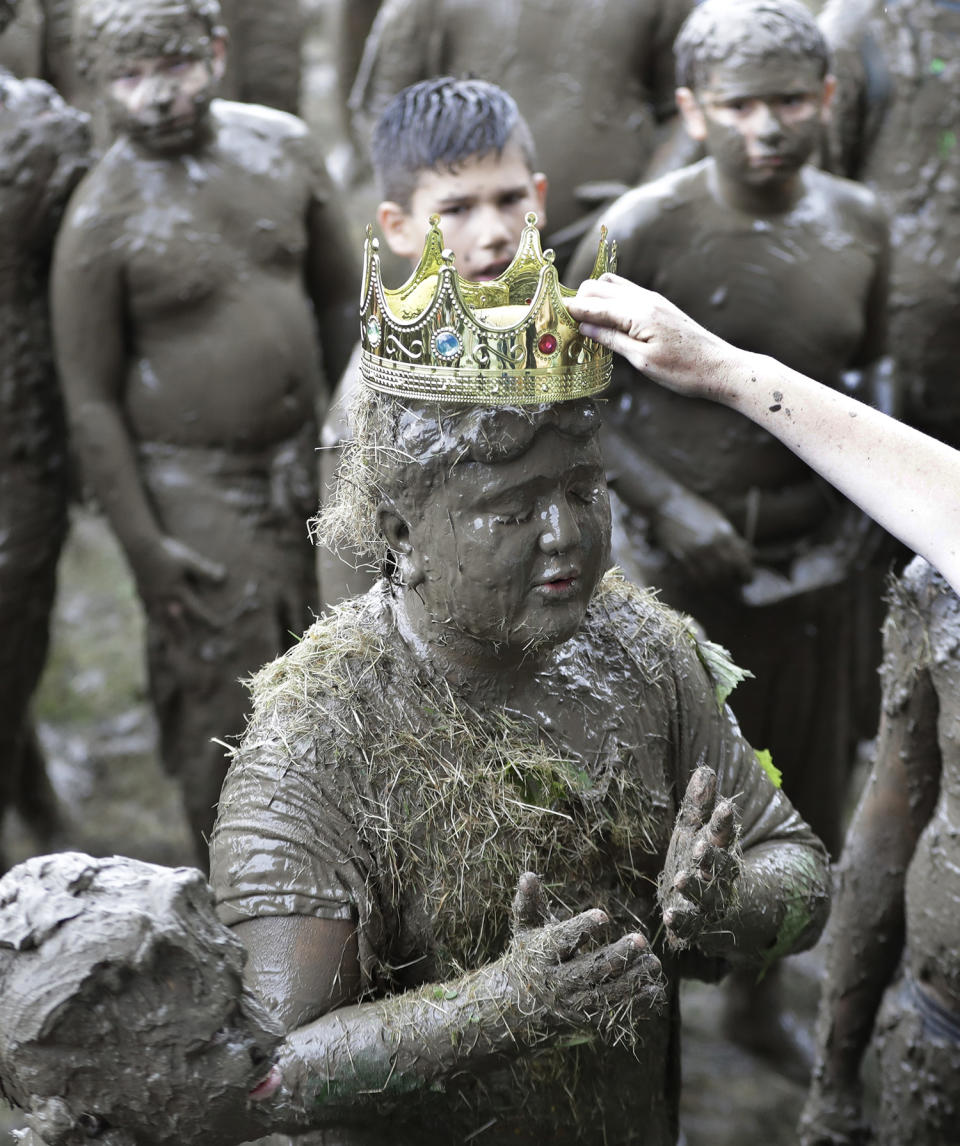 <p>Brian Wilson, 10, is crowned 2017 King of Mud Day at the Nankin Mills Park, July 11, 2017 in Westland, Mich. (Photo: Carlos Osorio/AP) </p>