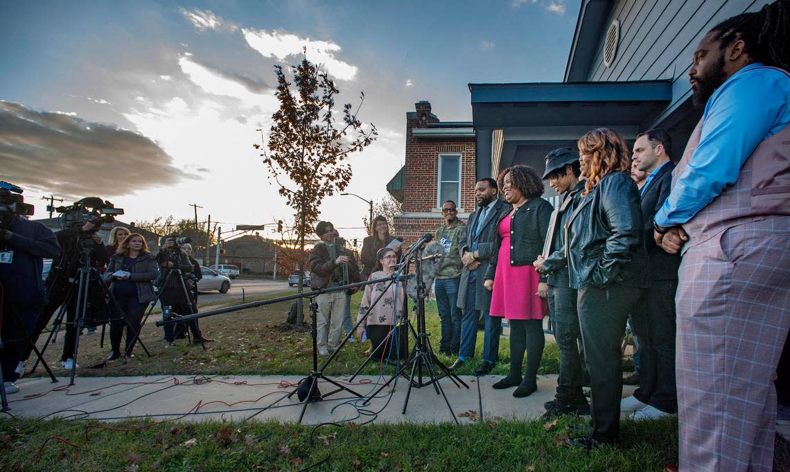 Ashley Carr, Atatiana Jefferson’s sister, holds a press conference at their mother’s house on East Allen Avenue in Fort Worth on Tuesday, Dec. 20, 2022. With her is their attorney Lee Merritt, Fort Worth Councilman Chris Nettles and community activists and friends.