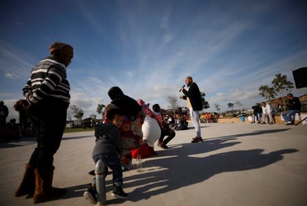 Community members gather in a park to discuss gang violence in Manenberg township, Cape Town