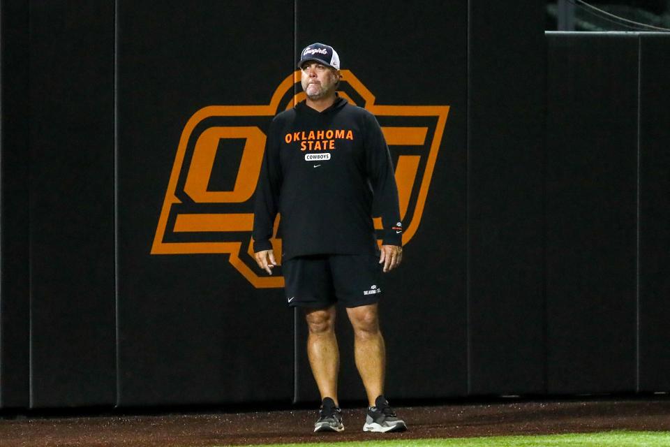 Oklahoma State’s Kenny Gajewski stands near the dugout during a pre-season softball game between Oklahoma State (OSU) and Tulsa (TU) at Cowgirl Stadium in Stillwater, Okla., on Thursday, Oct. 26, 2023.