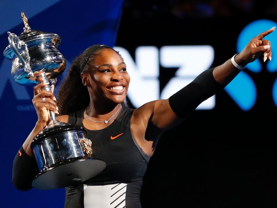 Serena Williams poses with her trophy after winning the 2017 Australian Open.