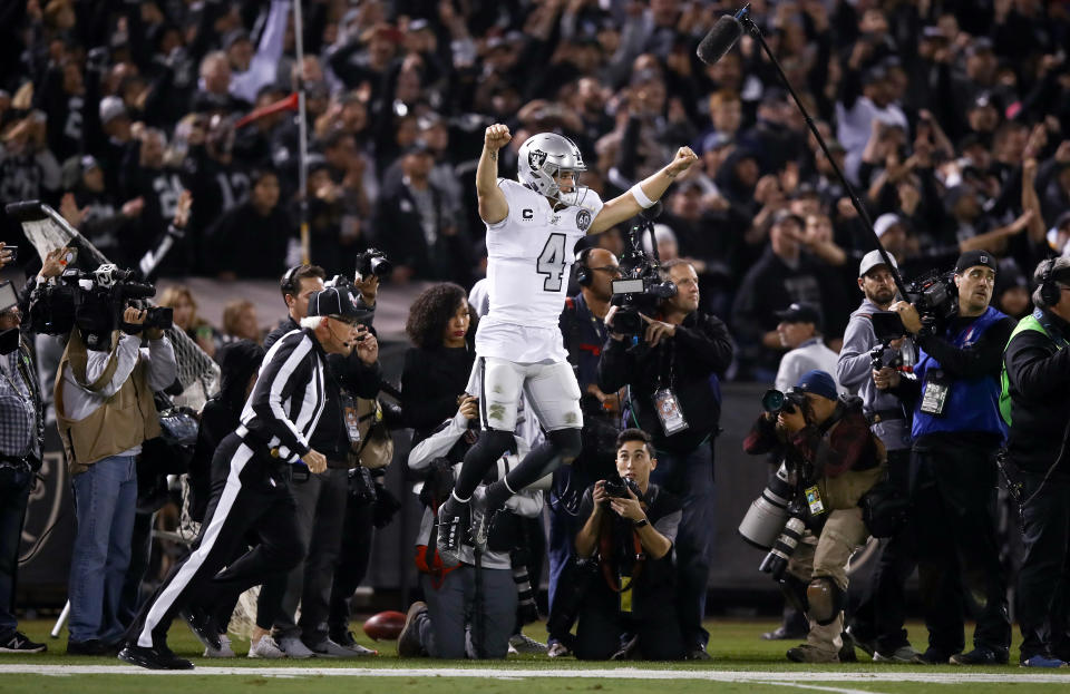 OAKLAND, CALIFORNIA - NOVEMBER 07:   Derek Carr #4 of the Oakland Raiders celebrates after the Raiders intercepted a pass on fourth down at the end of the fourth quarter to clinch their vicotry over the Los Angeles Chargers at RingCentral Coliseum on November 07, 2019 in Oakland, California. (Photo by Ezra Shaw/Getty Images)