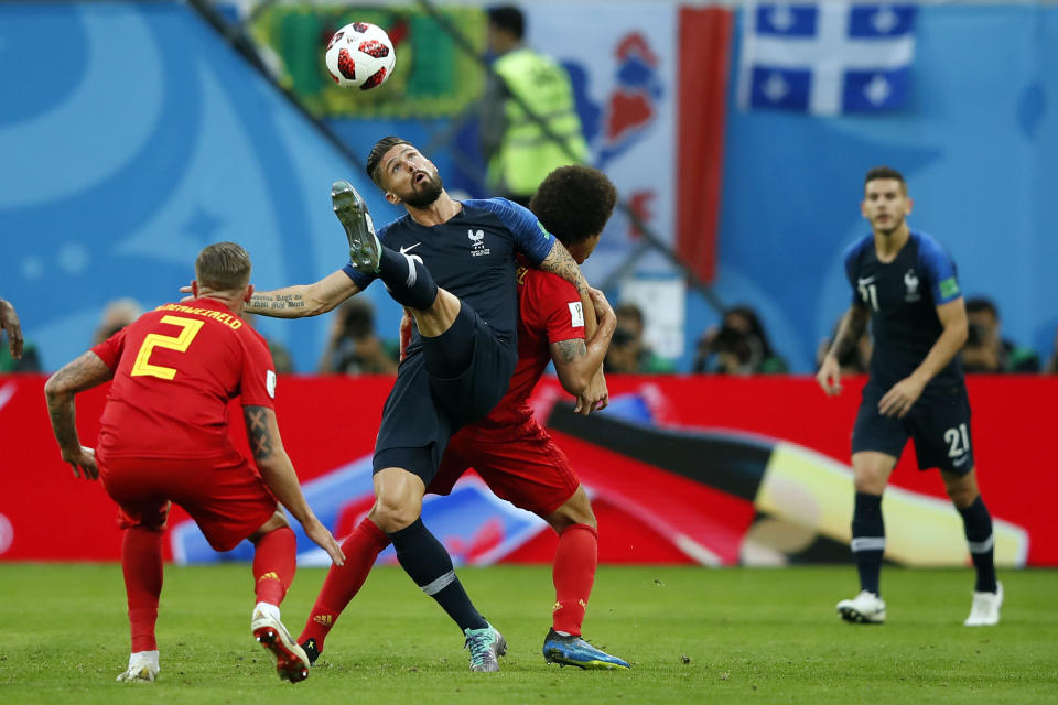 <p>France’s forward Olivier Giroud (2ndL) kicks the ball as he vies with Belgium’s defender Toby Alderweireld (C) during the Russia 2018 World Cup semi-final football match between France and Belgium at the Saint Petersburg Stadium in Saint Petersburg on July 10, 2018. (Photo by Odd ANDERSEN / AFP) </p>