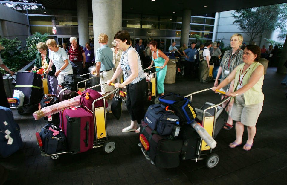 Passengers arrive at Los Angeles International Airport (LAX) Nov. 23, 2004 in Los Angeles, California.&nbsp;