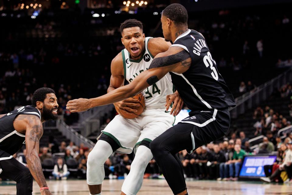 Bucks forward Giannis Antetokounmpo drives for the basket against Brooklyn Nets forward Nic Claxton during the first quarter at Fiserv Forum.