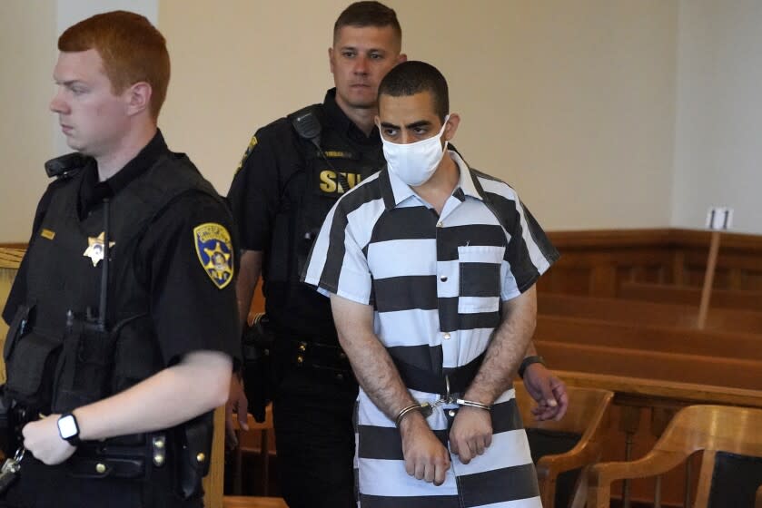 Hadi Matar, 24, arrives for an arraignment in the Chautauqua County Courthouse in Mayville, NY., Saturday, Aug. 13, 2022. Matar, accused of carrying out a stabbing attack against "Satanic Verses" author Salman Rushdie has entered a not-guilty plea in a New York court on charges of attempted murder and assault. (AP Photo/Gene J. Puskar)