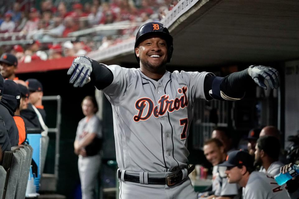 Detroit Tigers' Jonathan Schoop (7) celebrates in the dugout after hitting a solo home run during the third inning of a baseball game against the Cincinnati Reds, Friday, Sept. 3, 2021, in Cincinnati.