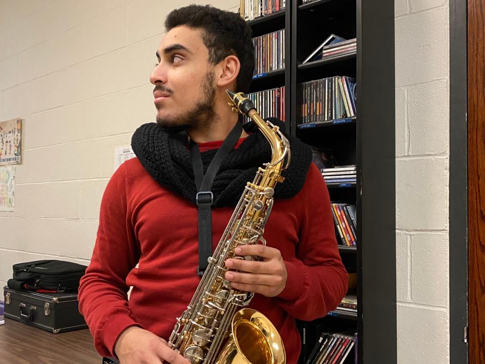 Taunton High School senior Caio Dos Santos-Amado with his saxophone on Feb. 1, 2023 at the high school