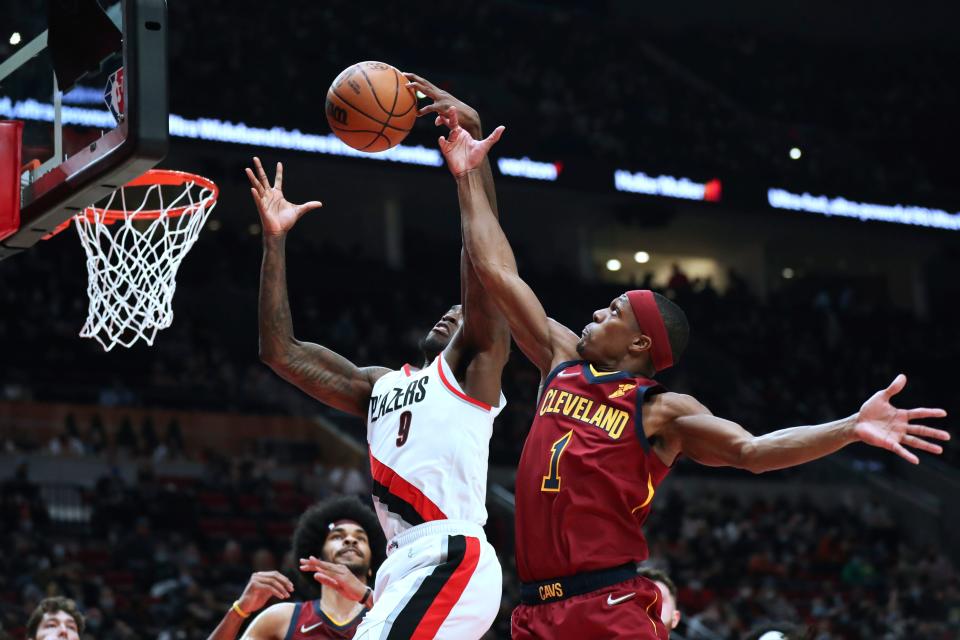 Cavaliers guard Rajon Rondo attempts to block a shot by Portland Trail Blazers forward Nassir Little during the first half of Friday night's NBA game. The Cavs won 114-101. [Amanda Loman/Associated Press]