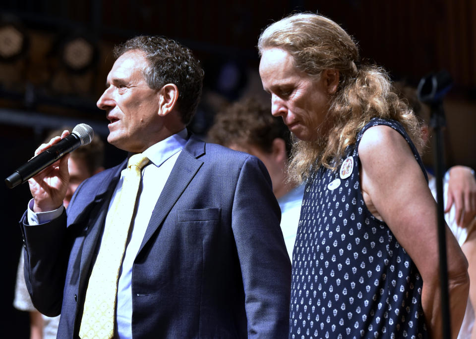 Rep. Andy Levin, left, D-Mich., stands with his wife, Mary Freeman, as he addresses supporters and volunteers after conceding to Rep. Haley Stevens in the Democratic primary, Tuesday night, Aug. 2, 2022, in Pontiac, Mich. (Todd McInturf/Detroit News via AP)