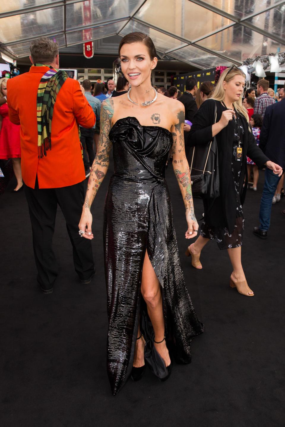 <p>Ruby showed off her slender frame in a strapless black floor-length gown.</p>