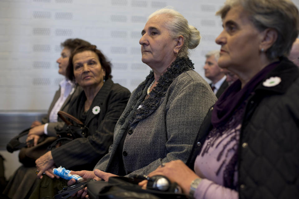 Women from the Bosnian town of Srebrenica wait for judges to enter a court in The Hague, Netherlands, Monday, April 7, 2014. Mothers and widows of men murdered in Europe's worst massacre since World War II are suing the Dutch government for failing to protect their husbands and sons during the 1995 Srebrenica genocide. The civil case starting Monday in the courtroom focuses on the failure of Dutch troops serving as United Nations peacekeepers to protect Muslim men in the protected enclave in eastern Bosnia from rebel Serbs who overran the town and killed some 8,000 men and boys. (AP Photo/Peter Dejong)