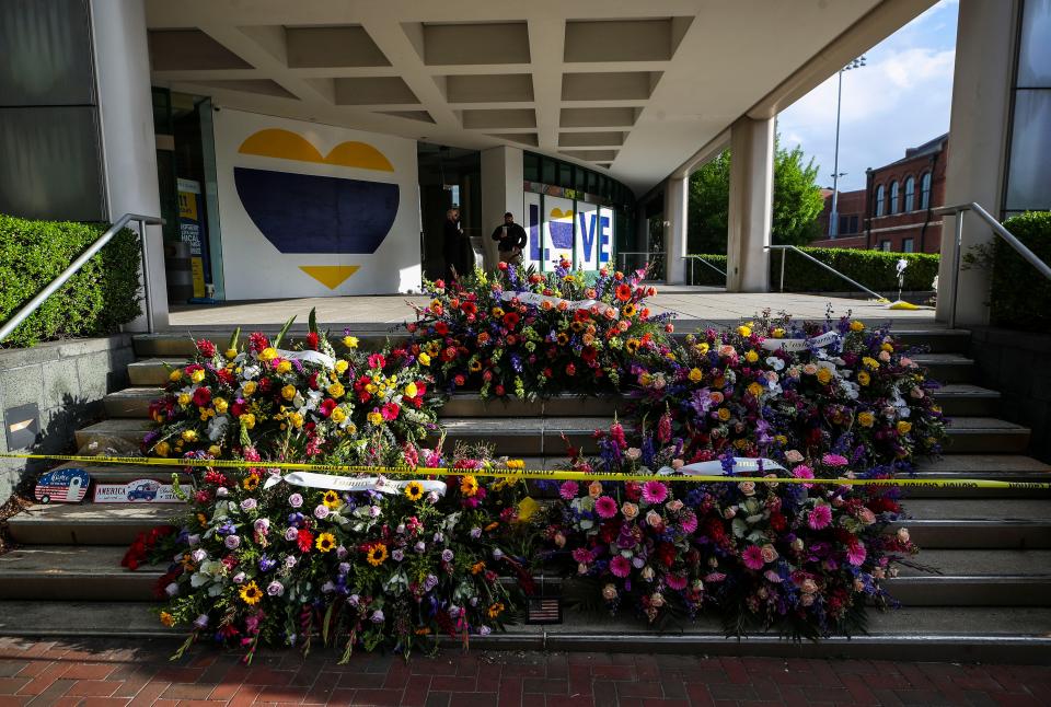 Five days after the mass shooting at Old National Bank where five people were shot and killed and nine injured by an employee, flowers and balloons cover the front steps on Main Street downtown.  April 14, 2023