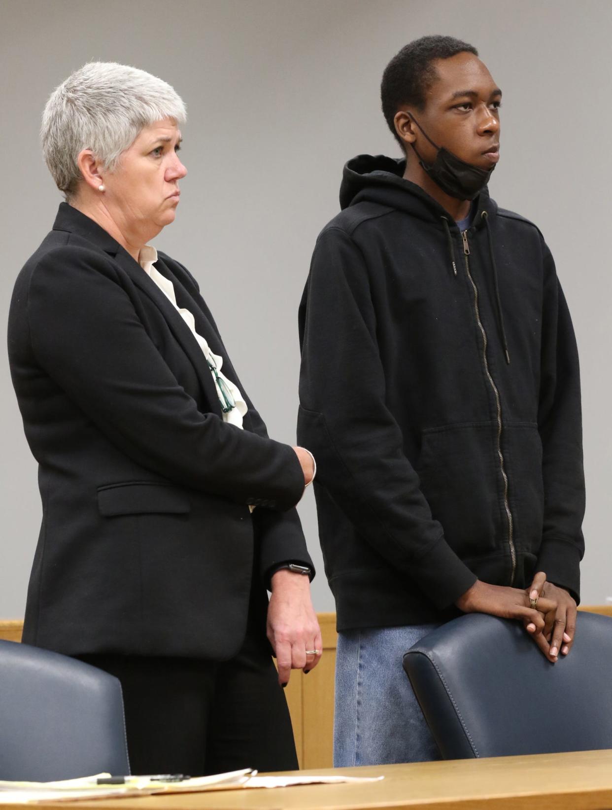 Attorney Chrissy Clarke-Peckham stands with La’Dainian Fuller before Judge David Phillips Thursday afternoon, Nov. 2, 2023, at the Gaston County Courthouse.