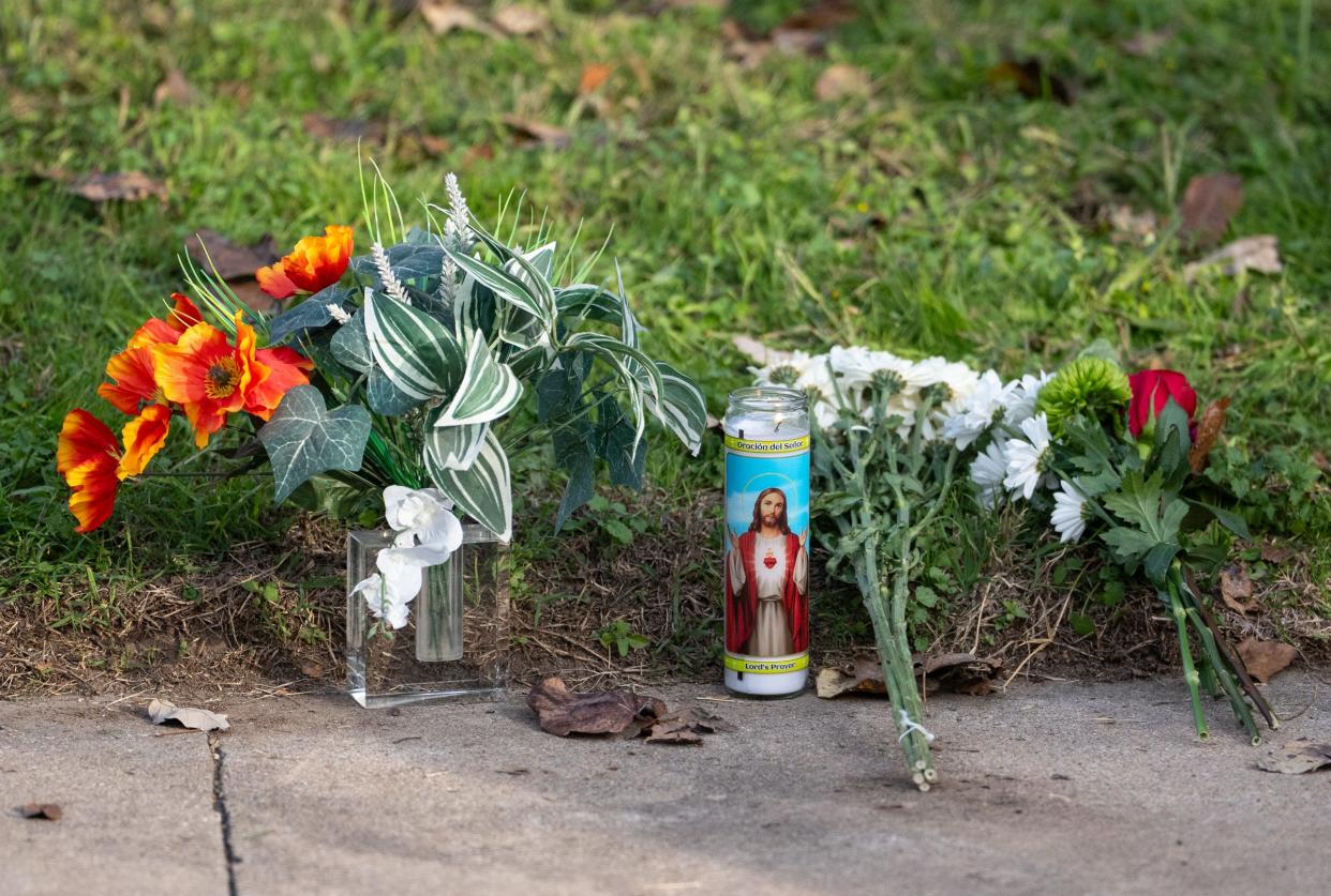 A memorial on the sidewalk along Shadywood Drive in Austin, Dec. 6, 2023, near the site of two deaths that where part of a multi-county wave of violence that left six dead and three injured in Austin and San Antonio.