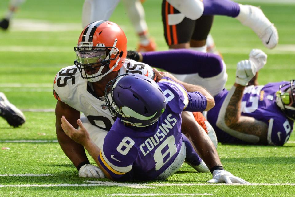Cleveland Browns defensive end Myles Garrett hits Minnesota Vikings quarterback Kirk Cousins during the game earlier this month at U.S. Bank Stadium.