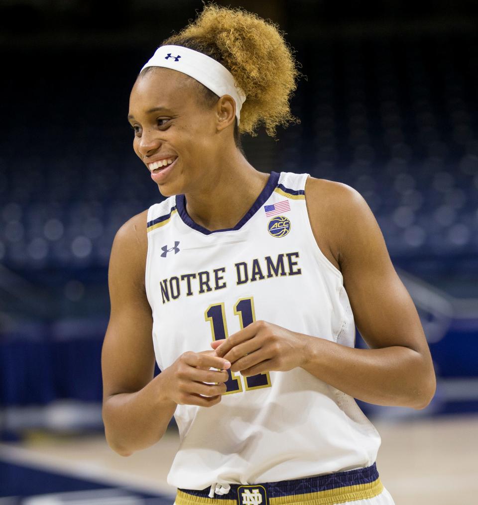 Brianna Turner, then a Notre Dame basketball player, laughs with teammates during the team's media day in October 2018.