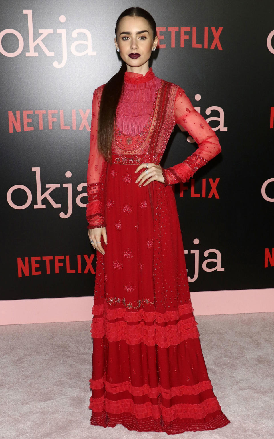 <p><strong>8 June</strong> Lily Collins attended the New York premiere of <em>Okja</em> wearing a bold red Valentino dress with co-ordinating plum red lipstick. </p>