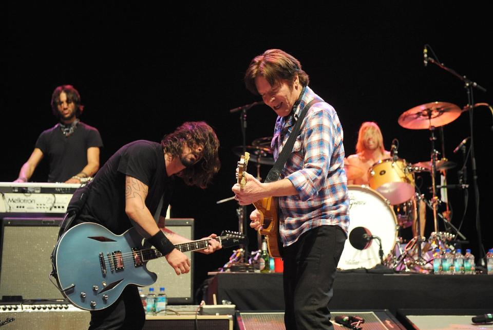 Musician Dave Grohl, left, and John Fogerty perform on stage at the Sound City Players concert at The Manhattan Center Hammerstein Ballroom, Wednesday, Feb. 13, 2013, in New York. (Photo by Brad Barket/Invision/AP)