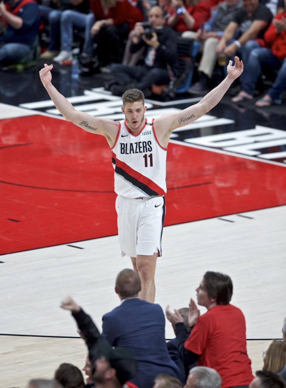 Portland Trail Blazers forward Meyers Leonard gestures to the crowd during the first half of Game 4 of the NBA basketball playoffs Western Conference finals against the Golden State Warriors, Monday, May 20, 2019, in Portland, Ore. (AP Photo/Craig Mitchelldyer)