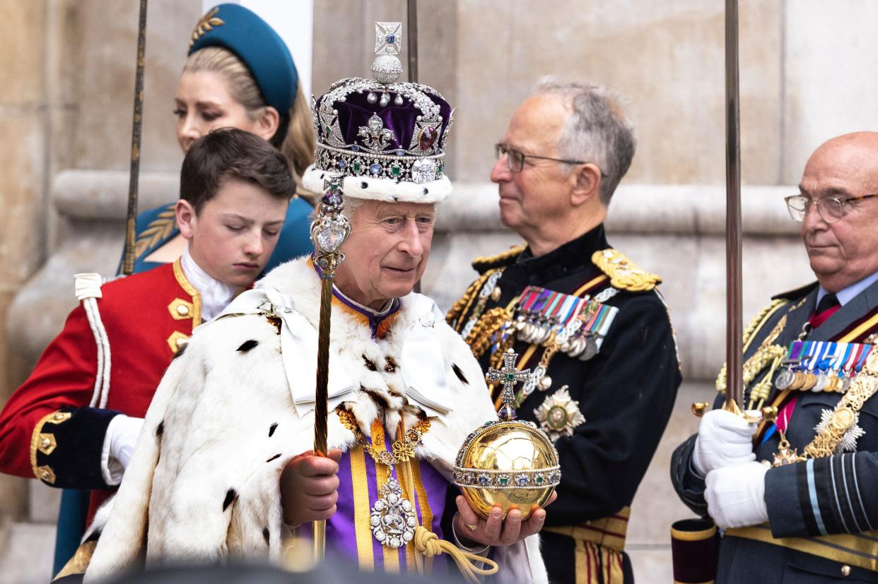Britain's King Charles III leaves Westminster Abbey after coronation ceremony, in London, Saturday, May 6, 2023. (Humphrey Nemar/Pool Photo via AP)