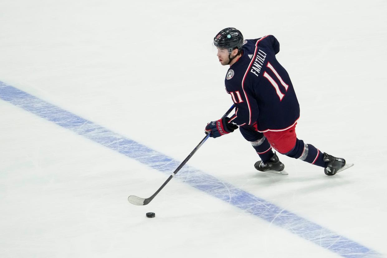 Jan 15, 2024; Columbus, Ohio, USA; Columbus Blue Jackets center Adam Fantilli (11) skates up ice during the second period of the NHL hockey game against the Vancouver Canucks at Nationwide Arena.